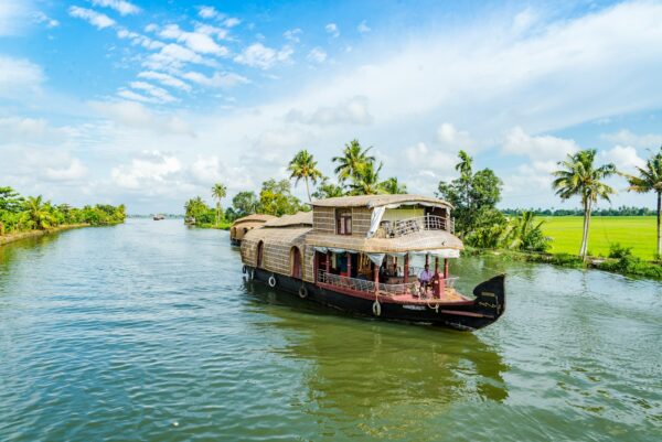 brown wooden boat on body of water during daytime